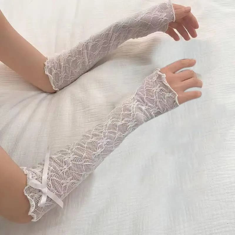 Gants fingerless Y2K dentelle volants mesh fishnet avec nœud papillon noir blanc style JK Lolita