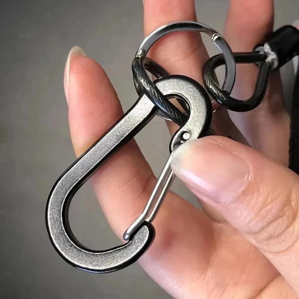 Pince anti-perte pour leurres avec cordon et ressort spiralé pour pêche à la ligne